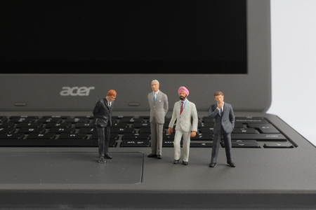 the group of people figures on the laptop