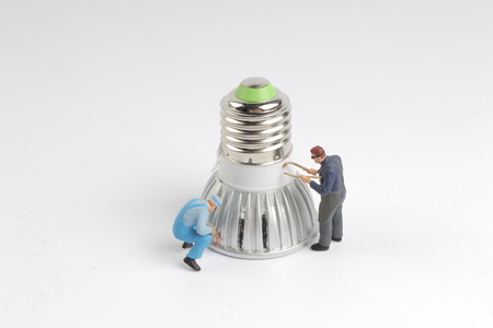 THE Min worker with pickaxe working on a sparkplug