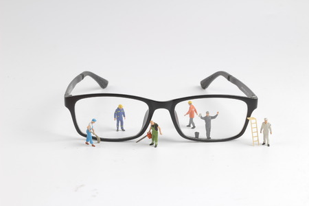 the Mini technician repairing reading of glassesの写真素材
