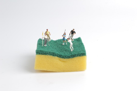 the mini figure are playing golf at  spongesの写真素材