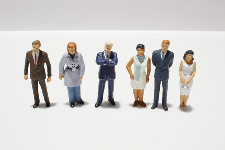 Mini figures of business on a white back groundの写真素材
