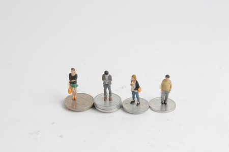 the family on coins pile. Macro photo