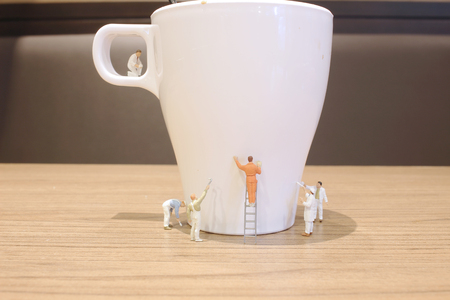 the Min worker clear the mug of drinkの写真素材