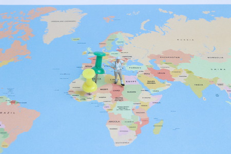 MINI people backpacker walking on world mapの写真素材