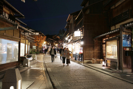 Bustling pedestrian street on a hill lined at nightのeditorial素材