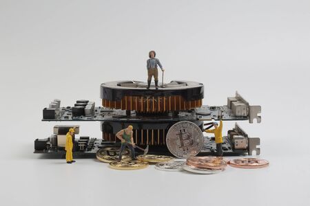 the group figure mining bitcoins from computerの写真素材