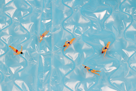 the Figurines Swimming In Water back groundの写真素材