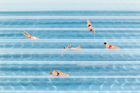 the Figurines Swimming In Water back groundの写真素材