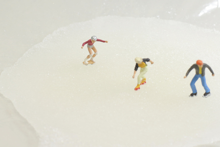 A fun of Tiny toy skaters on iceの写真素材