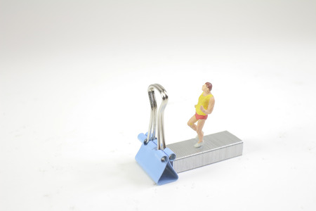 small figure with jogging woman on sport 