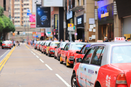 the red taxi waiting at the font of Times Square のeditorial素材