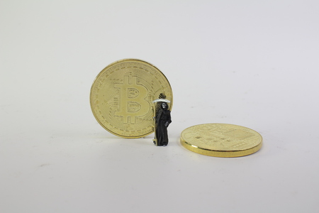 

the Demon of death standing with bitcoin. の写真素材