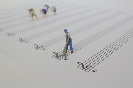the mini woker clear on the music sheetの写真素材