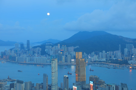 Skyline of Hong Kong at night with the moonのeditorial素材
