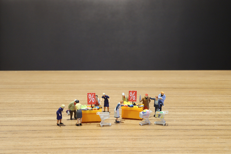 a Mini people Shoppers buy goods on saleの写真素材
