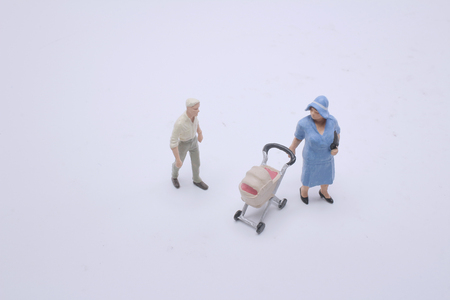 mother  figurine  and baby stroller.の写真素材