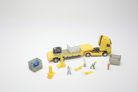 the  figurine of worker with a lorryの写真素材