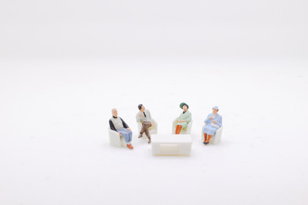 the   figure sit on the chairの写真素材