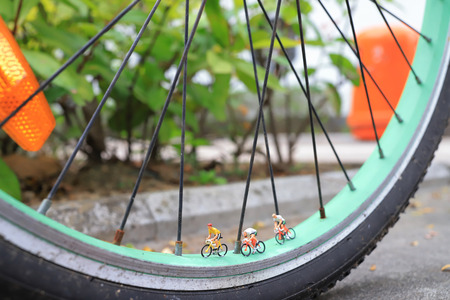 the tiny of figure ride the bike on bikeの写真素材