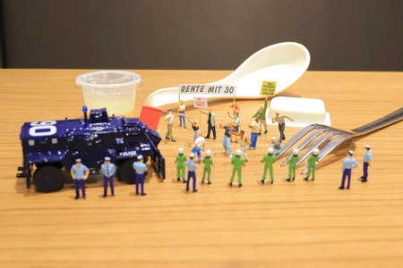 the figure of Pedestrians, demonstrators and onlookers walking alongの写真素材