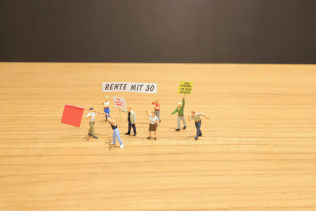 the figure of Pedestrians, demonstrators and onlookers walking alongの写真素材