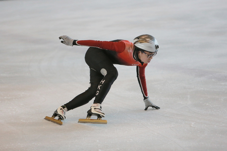 Speed skaters during a race in an indoors ice rinkのeditorial素材