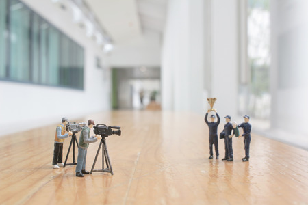 the driver mini figure with cup at the backgroundの写真素材