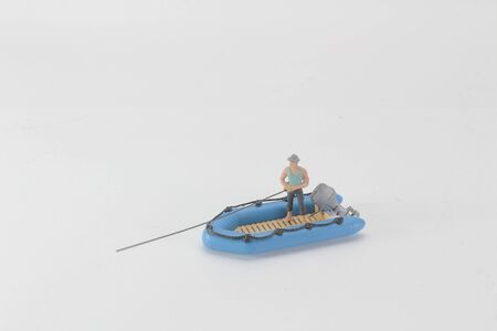 mini figure fishing on boat.の写真素材
