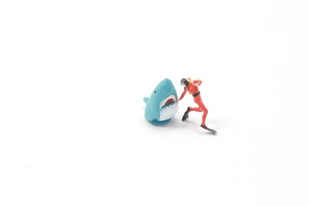 the mini Man figure dive with Sharkの写真素材