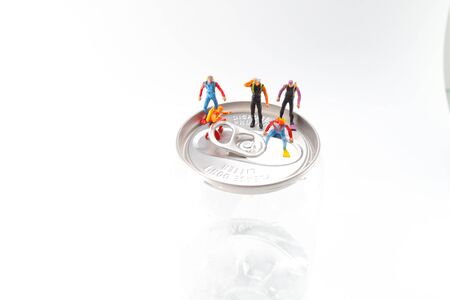the small diver stands on an open aluminum canの写真素材