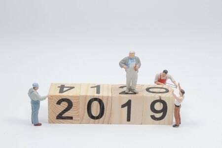 mini worker team create number 2020 and remove number 2019の写真素材