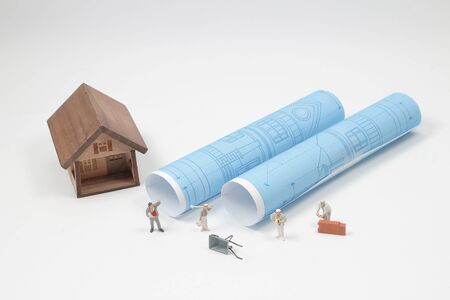 a min figure Building House and Evacuation Planの写真素材