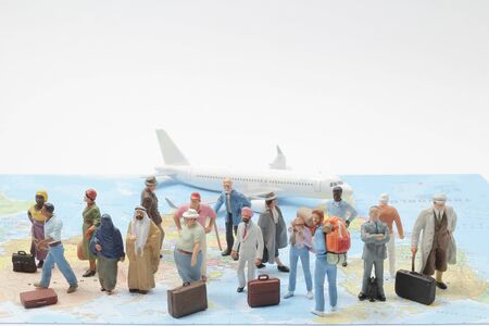 mini figure of Business Travelers Standing On A Map, traveling concept imageの写真素材