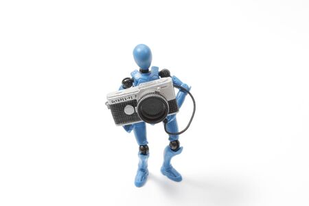 Mini figure toy of robot man with camera, concept of photographyの写真素材