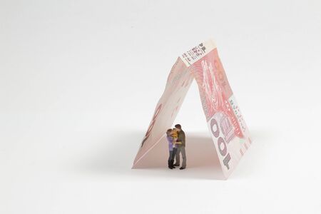 mini figure of family with The Bank note, concept of family wealth managementの写真素材