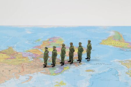 figure toy of soldier stand on the map, concept of militaryの写真素材