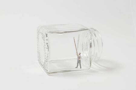 Figure toy of man cleaning the inner glassの写真素材