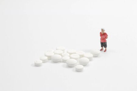 the mini Old man face of the Medicine pillsの写真素材