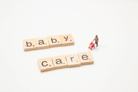 the mini figure mother with the text wood cubesの写真素材