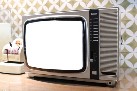 the Retro old TV screen receiver on table の写真素材