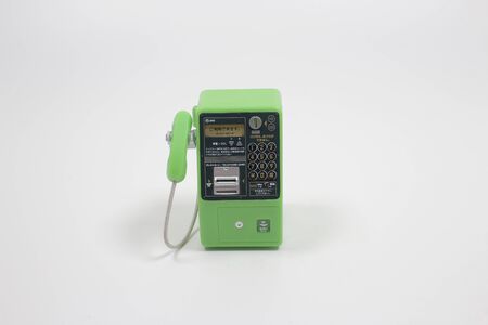 a scale of Japanese pay phone on the boardの写真素材
