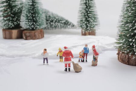 the mini of fun figure in snow covered winter landscapeの写真素材