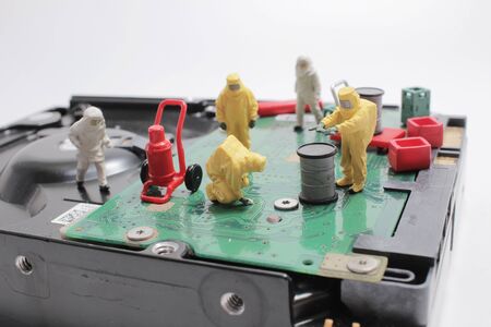 a Team of engineers repairing circuit boardの写真素材