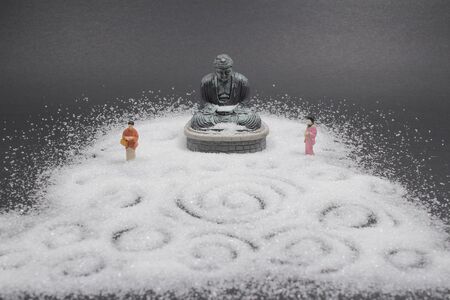 the figure with Zen buddha and  sandの写真素材