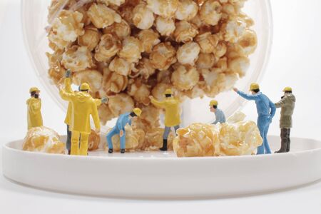 the mini worker figure face the throw Popcornの写真素材