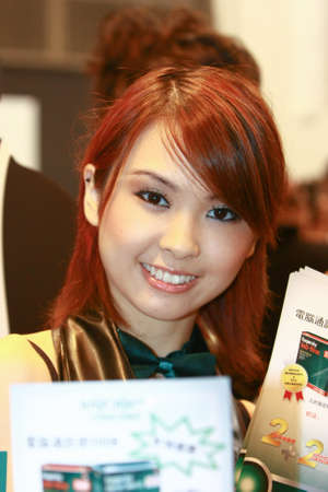 Hong Kong 23 Aug 2008 : Beautiful hostess at computer exhibitionのeditorial素材