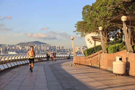 the runner run at the Wan Chai Waterfront Promenadeのeditorial素材