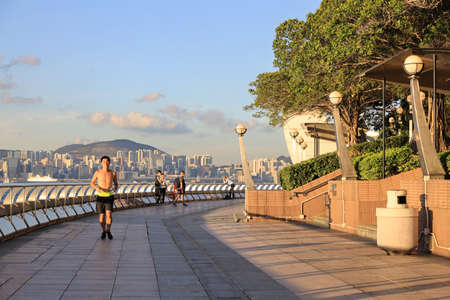 the runner run at the Wan Chai Waterfront Promenadeのeditorial素材