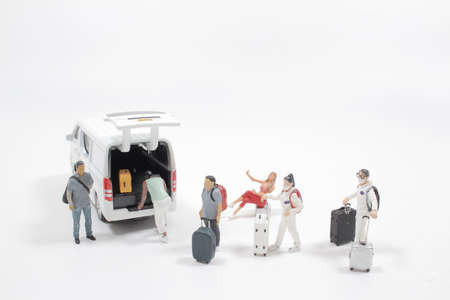 the figure passenger boarding on travel van with luggageの写真素材