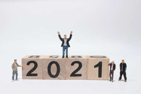 figure team create wooden block number 2021